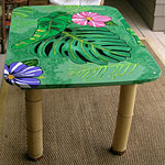 Patio table with leaf painted on it.